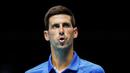 Petenis Serbia, Novak Djokovic, tampak menghela nafas usai ditaklukkan Petenis Rusia, Daniil Medvedev, pada ATP Finals di O2 Arena, London, Kamis (19/11/2020). Petenis nomor satu dunia itu takluk 3-6 3-6. (AP/Frank Augstein)