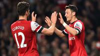 Kerjasama apik antara Olivier Giroud dan Mesut Ozil berikan kemenangan Arsenal 2-0 atas Bournemouth.