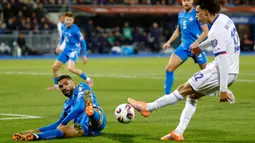 Hasil ini tak mengubah posisi Prancis di klasemen Grup D. Les Bleus masih kokoh bertengger di puncak klasemen dengan poin 10 dari empat laga yang sudah dilakoni. (AP Photo/Brynjar Gunnarsson)