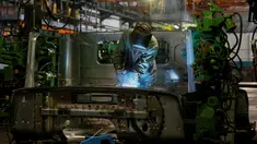 Seorang karyawan saat mengelas komponen truk lapis baja KrAZ-6322RA di Pabrik AutoKrAZ, Kremenchuk, Ukraina, Selasa (14/6). Truk ini diproduksi dengan berbagai kelebihan untuk keperluan pertahanan. (REUTERS / Valentyn Makarenko)