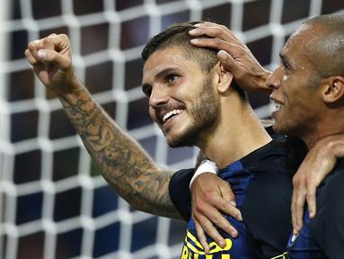Inter Milan meraih kemenangan 2-1 atas Juventus dalam laga pekan keempat Serie A yang berlangsung di Giuseppe Meazza, Minggu (18/9/2016) malam WIB. Dua gol Inter dicetak Mauro Icardi dan Ivan Perisic. (AFP/Marco Bertorello)