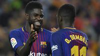 5. Samuel Umtiti (Prancis) - Sebesar 500 juta euro dengan kontrak hingga 30 Juni 2023. (Photo by LLUIS GENE / AFP)