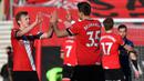 Pemain Southampton, James Ward-Prowse dan Jan Bednarek, merayakan kemenangan atas Arsenal pada laga Piala FA di Stadion St Mary, Sabtu (23/1/2021). Arsenal tumbang dengan skor 1-0. (AFP/Ben Stansall)