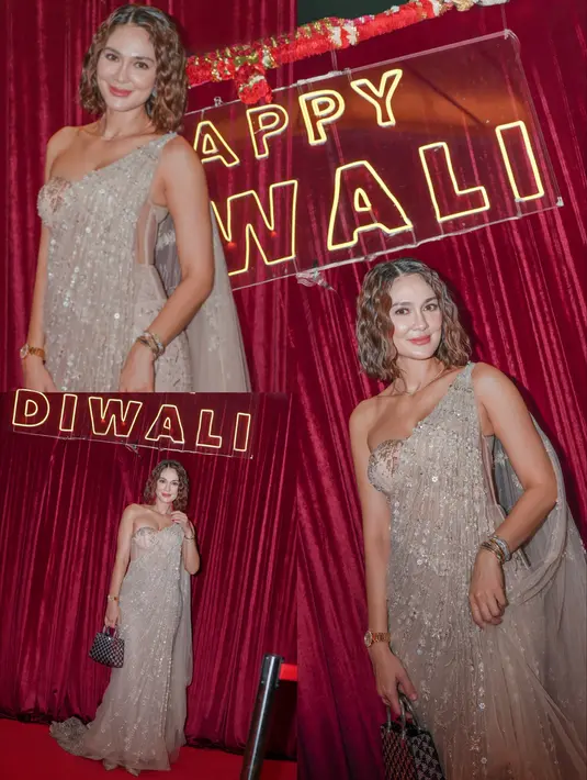 Busana nude itu dilengkapi dengan aksen kain tulle berpayet yang menjuntai dari bahu hingga lantai [@lunamaya]