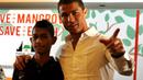 Martunis dan ayah angkatnya, Cristiano Ronaldo. (AFP)
