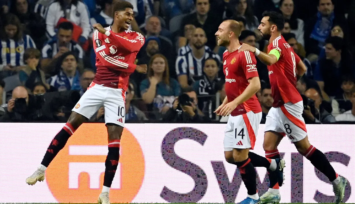 FC Porto tertinggal lebih dulu pada menit ke-7 setelah aksi apik pemain Manchester United Marcus Rashford. (MIGUEL RIOPA/AFP)