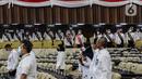 Sejumlah petugas memperagakan pimpinan lembaga tinggi negara dalam gladi bersih persiapan Sidang Tahunan MPR RI, Sidang Bersama DPR RI dan DPD RI dan Sidang Paripurna DPR RI di Kompleks Parlemen, Jakarta, Senin (15/8/2022). Presiden Joko Widodo akan kembali menyampaikan pidato kenegaraan dan keterangan pemerintah terkait RUU APBN 2023 dan Nota Keuangan dalam Rapat Tahunan MPR dan Rapat Bersama DPR & DPD RI pada Selasa, 16 Agustus 2022. (Liputan6.com/Johan Tallo)