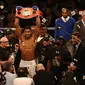 British boxer Anthony Joshua celebrates beating US boxer Charles Martin (not pictured) following their IBF World Heavyweight title boxing match at the O2 arena in London on April 9, 2016.