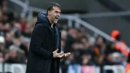 Gol kemenangan tim asuhan Julen Lopetegui itu dicetak oleh Tomas Soucek di babak pertama dan Aaron Wan-Bissaka pada babak kedua. (AFP/Paul Ellis)