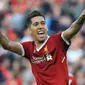 Pemain Liverpool, Roberto Firmino merayakan golnya ke gawang AFC Bournemouth pada lanjutan Premier League di Anfield stadium, Liverpool,(14/4/2018). Liverpool menang 3-0.  (AFP/Lindsey Parnaby)