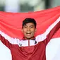 Atlet Indonesia, Saptoyogo Purnomo merayakan kemenangan di atas podium setelah memenangkan cabang olahraga Para Athletics Asian Para Games 2023 nomor Men's 400m-T37 yang berlangsung di Huanglong Sport Centre Stadium, Provinsi Zhejiang, China, Senin (23/10/2023). Ia mencatatkan waktu 54.80 detik. (NPC Indonesia)