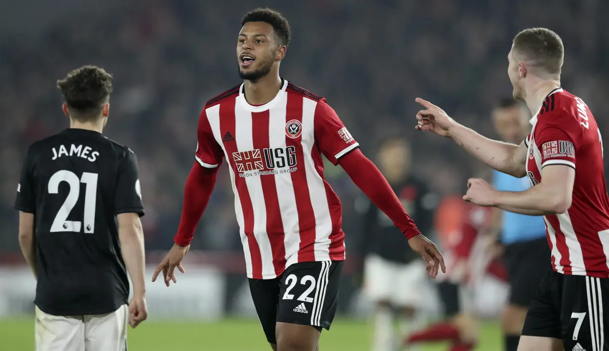Penyerang Sheffield United, Lys Mousset berselebrasi usai mencetak gol ke gawang Manchester United pada pertandingan lanjutan Liga Inggris di Stadion Bramall Lane (24/11/2019). MU bermain imbang 3-3 atas Sheffield Unite. (AP Photo/Jon Super)