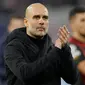 Pelatih Manchester City, Pep Guardiola bertepuk tangan untuk penggemar usai bertanding melawan  RB Leipzig pada pertandingan leg pertama babak 16 besar Liga Champions di Red Bull Arena, Jerman, Kamis (23/2/2023). Manchester City bermain imbang dengan Leipzig dengan skor 1-1. (AFP/Odd Andersen)