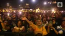 Sejumlah pengunjung menyaksikan konser musik pada acara "Pestapora 2022" di Gambir Expo Kemayoran, Jakarta, Sabtu (24/9/2022). Pada acara pertunjukan musik Indonesia yang berlangsung 23-25 September 2022 tersebut menghadirkan enam panggung pertunjukan dengan menampilkan berbagai musisi tanah air.  (Liputan6.com/Herman Zakharia)