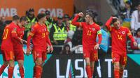 Selebrasi pemain Wales saat pertandingan playoff Piala Dunia 2022 kontra Ukraina di Stadion Cardiff, Wales, Minggu (5/6/2022). (AFP/Geoff Caddick)