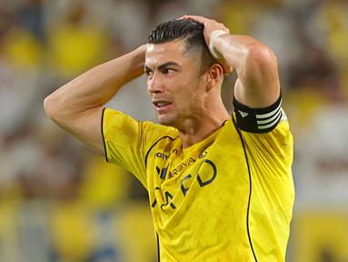 Perasaan kecewa tak mampu ditutupi Cristiano Ronaldo setelah Al Nassr gagal mengunci gelar juara Liga Arab Saudi musim 2025/2026 pada Selasa (12/05/2026) waktu setempat. (AFP/Fayez Nureldine)
