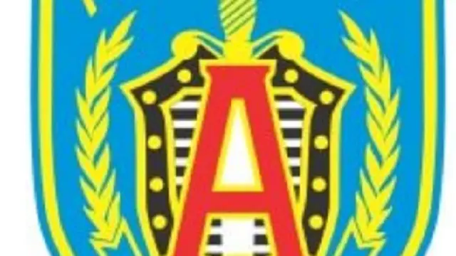 Lencana Alpha Group. (Wikimedia Commons)