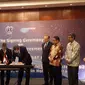 Penandatangan kerja sama penggunaan orbit milik Intersputnik untuk proyek satelit milik UNISAT pada Selasa (28/2/2017). (Liputan6.com/Agustinus Mario Damar)