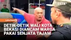 Wali Kota Bekasi Tri Adhianto bersama sejumlah petugas Satpol PP Kota Bekasi mendapat ancaman senjata tajam dari warga saat penertiban lapak di kawasan Bekasi Utara, Minggu petang. Pria tersebut tidak terima papan reklame dan dagangannya ditertibkan ...