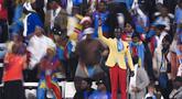 Seorang suporter Republik Demokratik Kongo mencuri perhatian saat mendukung timnya di Piala Afrika 2025. (AFP/Sebastien Bozon)