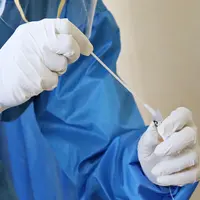 Ilustrasi tes Swab, PCR. (Photo by Mufid Majnun on Unsplash)