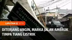 Hujan besar disertai angin kencang, Selasa siang melanda sebagian wilayah Kota Bekasi, Jawa Barat. Warung, plafon sekolah, hingga marka jalan ambruk.