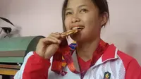 Emma Ramadinah, atlet cabang olahraga Sambo dari nomor mixed team peraih emas untuk kontingen Indonesia di ajang Sea Games 2019 Filipina. (Liputan6.com/ Abramena)