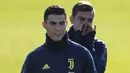 Ekspresi Ronaldo saat melakukan latihan jelang laga lanjutan grup H Liga Champions yang berlangsung di stadion Stade de Suisse, kamis (13/12). Juventus akan berhadapan dengan tuan rumah Young Boys. (AFP/Marco Bertorello)