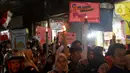 Suasana iring-iringan pawai obor di kawasan Pancoran Barat, Jakarta, Sabtu (9/3/2024). (Liputan6.com/Herman Zakharia)