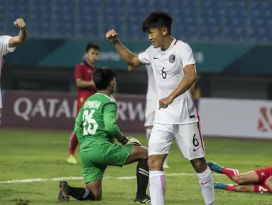Gelandang Hongkong, Tan Chun Lok, merayakan gol yang dicetaknya ke gawang Laos pada laga Grup A Asian Games di Stadion Patriot, Jawa Barat, Jumat (10/8/2018). Hongkong menang 3-1 atas Laos. (Bola.com/Vitalis Yogi Trisna)