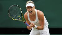 Eugenie Bouchard memiliki tinggi 178 cm dengan berat 61 kg. Dirinya biasa bermain dengan mengandalkan tangan kanannya. (AFP/Glyn Kirk)