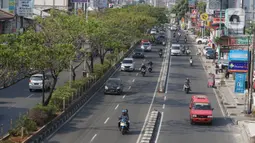 Kendaraan melintasi Jalan Margonda Raya, Depok, Jawa Barat, Selasa (20/11/2019).Saat ini Badan Pengelola Transportasi Jabodetabek (BPTJ) tengah merancang kerangka regulasi untuk pelaksanaan sistem electronic road pricing (ERP) di Jalan Margonda Raya. (Liputan6.com/Immanuel Antonius)
