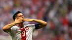Striker Polandia, Robert Lewandowski memimpin klasemen pencetak gol terbanyak pada kualifikasi Piala Eropa 2016 dengan total 13 gol dalam 10 pertandingan. (AFP Photo/Andy Buchanan)