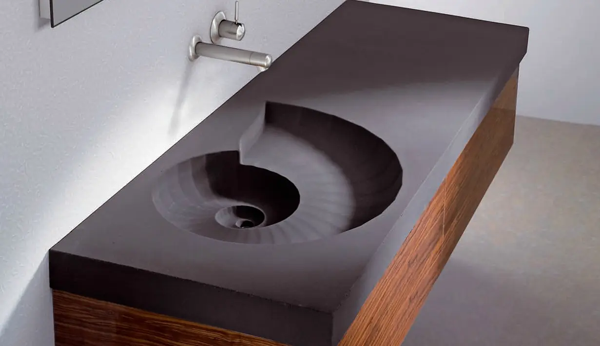Ammonite Washbasin merupakan Wastafel berbentuk seperti ammonoidea dari keluarga chepalopoda, binatang purbakala dari masa 400 juta tahun lalu. Strukturnya spiral, sehingga air akan mengalir seperti menuruni tangga. (nash-remont.com)