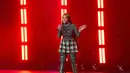 Nicki Minaj saat tampil di atas panggung Powerhouse NYC di Newark, New Jersey pada 29 Oktober 2022. Rapper "Super Freaky Girl" itu tampil dengan busana serba hijau. (Roy Rochlin/Getty Images untuk iHeartRadio/AFP)