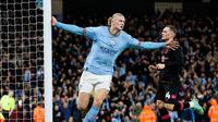 Pemain Manchester City Erling Haaland melakukan selebrasi usai mencetak gol ke gawang Burnley pada pertandingan sepak bola perempat final Piala FA di Etihad Stadium, Manchester, Inggris, Sabtu (18/3/2023). (Richard Sellers/PA via AP)