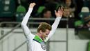 Pemain Wolfsburg, Andre Schuerrle merayakan golnya ke gawang KAA Gent pada leg kedua babak 16 besar Liga Champion di di Volkswagen Arena, Wolfsburg, Rabu (9/3/2016) dini hari WIB. (AFP/John Macdougall)