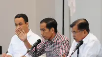 Jokowi-JK didampingi Anies Baswedan memaparkan 9 program, di antaranya adalah meningkatkan kesejahteraan PNS, TNI dan Polri. Kemudian, mengalokasikan dana untuk desa dan menurunkan tingkat pengangguran, Kamis (3/7/14) (Liputan6.com/Andrian M Tunay)