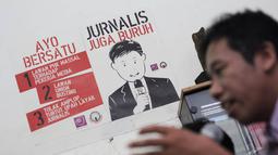 AJI mendesak agar pemerintah melakukan revisi terhadap UU ITE Nomor 11 Tahun 2008, khususnya dalam Pasal 27, yang menjadi pintu masuk kriminalisasi atas kebebasan berpendapat di internet, Jakarta, Selasa (23/12/2014). (Liputan6.com/Faizal Fanani)