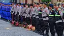 Team Polri untuk misi kemanusiaan internasional di Turki dan Suriah saat apel pelepasan di Mabes Polri Jakarta, Kamis (9/2/2023). Polri mengirimkan bantuan sebanyak 26 orang personel untuk misi kemanusiaan internasional gempa Turki dan Suriah, dengan tiga unsur yakni tim medis, DVI, dan K9. (Liputan6.com/Angga Yuniar)
