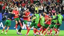 Menang adu penalti atas Slovenia, Portugal berhasil lolos ke perempat final Euro 2024. (PATRICIA DE MELO MOREIRA/AFP)