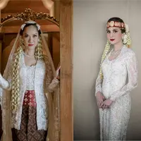 Di pernikahan ke-2 nya, BCL mengenakan kebaya kutubaru putih rancangan Didiet Maulana yang dipadukan obi merah dan kain batik coklat sebagai bawahan. Lengkap dengan veil panjang yang indah. [Foto: IG/Iluminen]