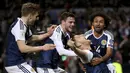 Bek Skotlandia, Chris Martin, merayakan gol yang dicetaknya ke gawang Slovenia pada laga kualifikasi Piala Dunia 2018 di Stadion Hampden Park, Skotlandia, Minggu (26/3/2017). Skotlandia menang 1-0 atas Slovenia. (AP/Jane Barlow)