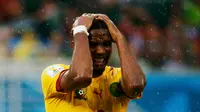 Ekspresi penyerang Kamerun, Samuel Eto'o, setelah gagal memanfaatkan peluang mencetak gol ke gawang Meksiko di babak penyisihan grup A Piala Dunia 2014 di Estadio das Dunas, Natal, Brasil, (13/6/2014). (REUTERS/Jorge Silva)