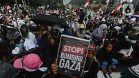 Massa dari organisasi masyarakat (ormas) Islam yang tergabung dalam Aliansi Rakyat Indonesia Bela Palestina (ARBPI) saat melakukan aksi unjuk rasa di kawasan Patung Kuda, Jakarta, Minggu (9/6/2024). (merdeka.com/Arie Basuki)