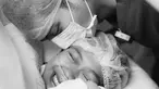 Teuku Ryan mencium istrinya yang telah bersalin. Ria Ricis tampak bahagia meski air matanya tak terbendung. (Foto: Bukaan Moment via Instagram/ okisetianadewi)