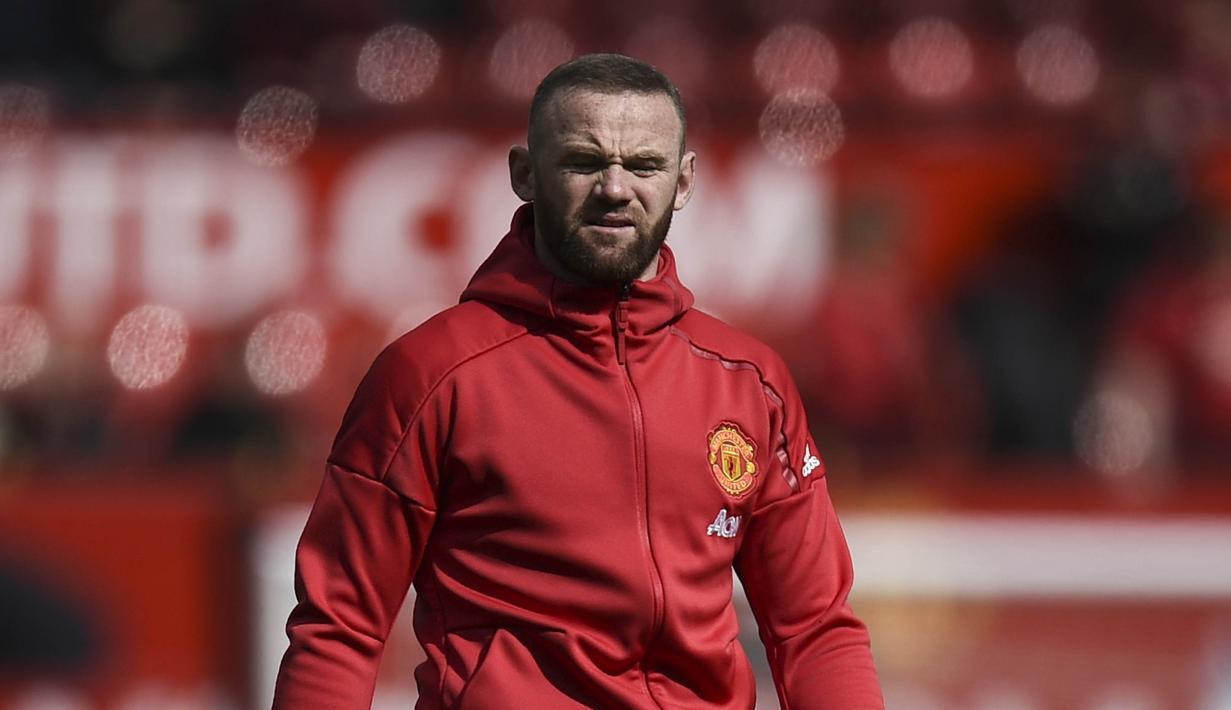 Kepergian Wayne Rooney tidak lepas dari minimnya kesempatan bermain di MU pada musim lalu. (AFP/Oli Scarff)