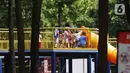 Anak-anak bermain di area Taman Puring, Jakarta Selatan, Minggu (26/12/2021). Memanfaatkan libur Natal dan Tahun Baru banyak warga memanfaatkan bersama keluarga berwisata ke taman karena hemat biaya. (Liputan6.com/Angga Yuniar)