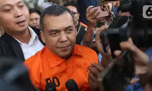 Wakil Menteri Imigrasi dan Pemasyarakatan (Wamen Imipas), Silmy Karim, saat menuju mobil tahanan usai menjalani pemeriksaan intensif di Gedung Merah Putih Komisi Pemberantasan Korupsi (KPK), Jakarta, Kamis (4/6/2026). (Liputan6.com/Helmi Fithriansyah)