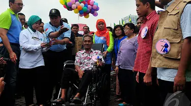 Ahok dan Mensos Khofifah saat acara peringatan Hari Kesetiakawanan Sosial Nasional, Jakarta, Sabtu (13/12/2014). (Liputan6.com/Johan Tallo)